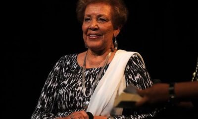 Image Alt Text Joylette Goble, daughter of NASA mathematician Katherine Johnson, with an educational illustration representing her family's scientific legacy.